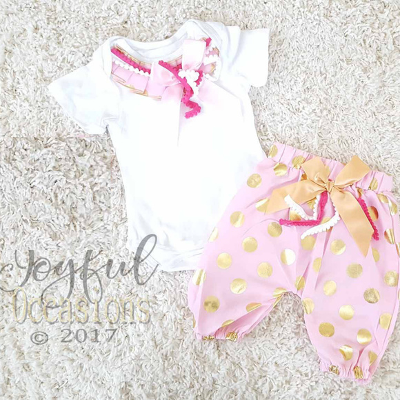 pink and gold baby outfit
